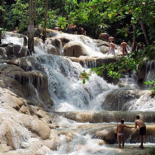 People climbing Dunn's River Falls, near Ocho Rios, Jamaica.