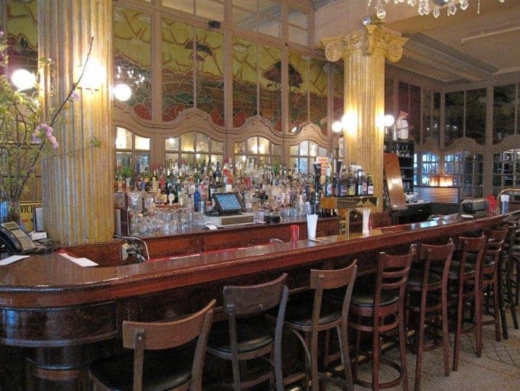 The original bar at Cafe Un Deux Trois in New York City and a Perfect Manhattan.