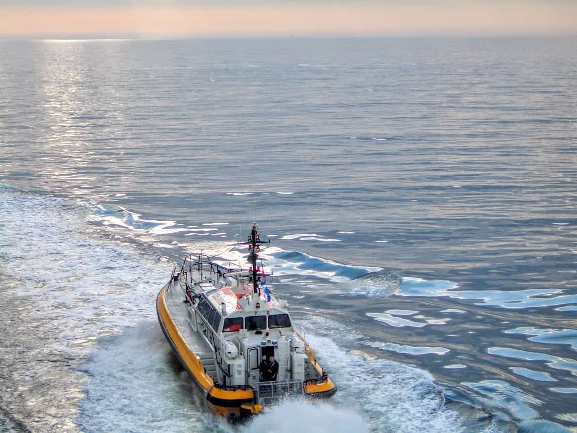 Tug boat leaving port of Helsinki Finland