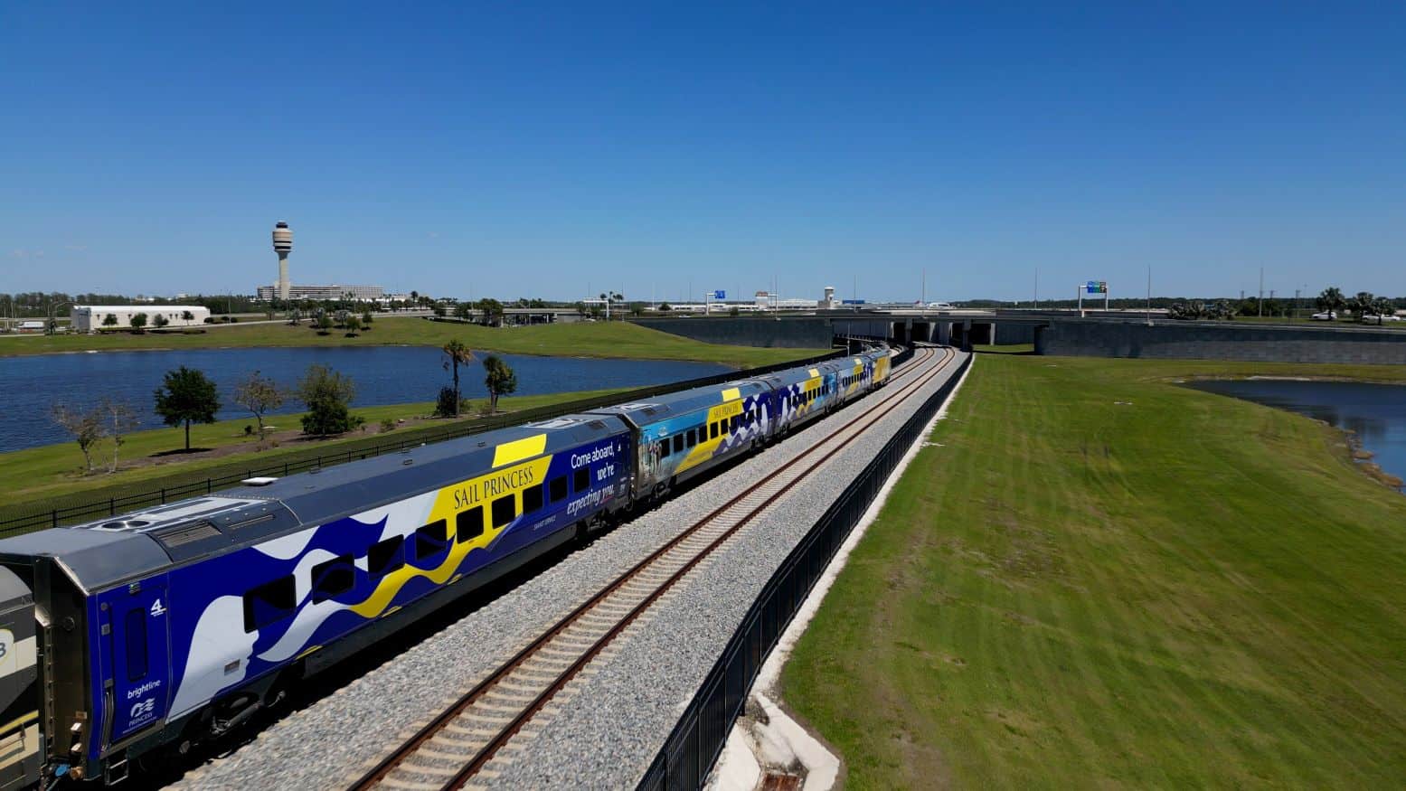 Brightline train wrapped with Princess Cruises design going to Ft. Lauderdale.