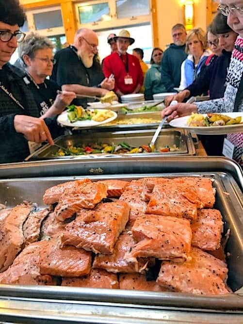 Trays of grilled salmon, vegetables, corn on the cob at Orca Point Lodge.