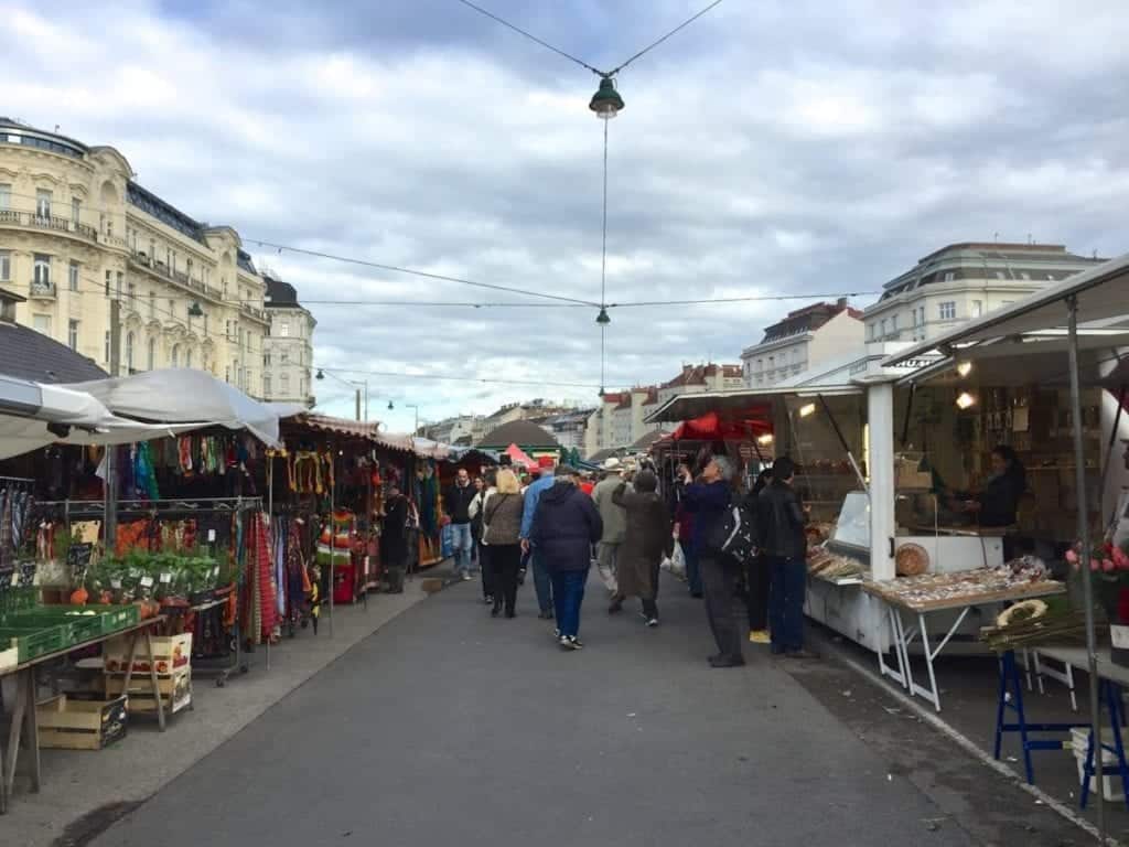 People walking through the Naschmarkt in Vienna.