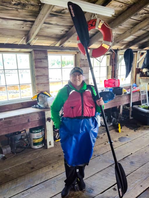 Eagle Island sea kayak gear with life jacket and paddle.