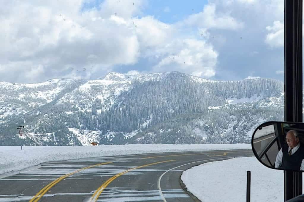 Driving along the snowy road leaving Mount St. Helens