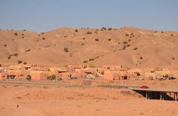 Navaho pueblo homes blend into the landscape.