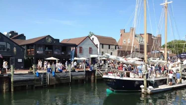 Newport, Rhode Island harbor view with sailing ship.