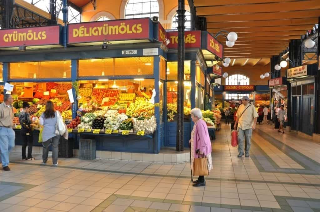 The indoor Central Market Hall colorful fruit and food stands.