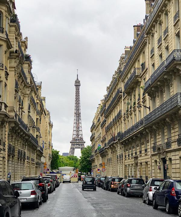 Eiffel Tower Paris seen from a narrow street