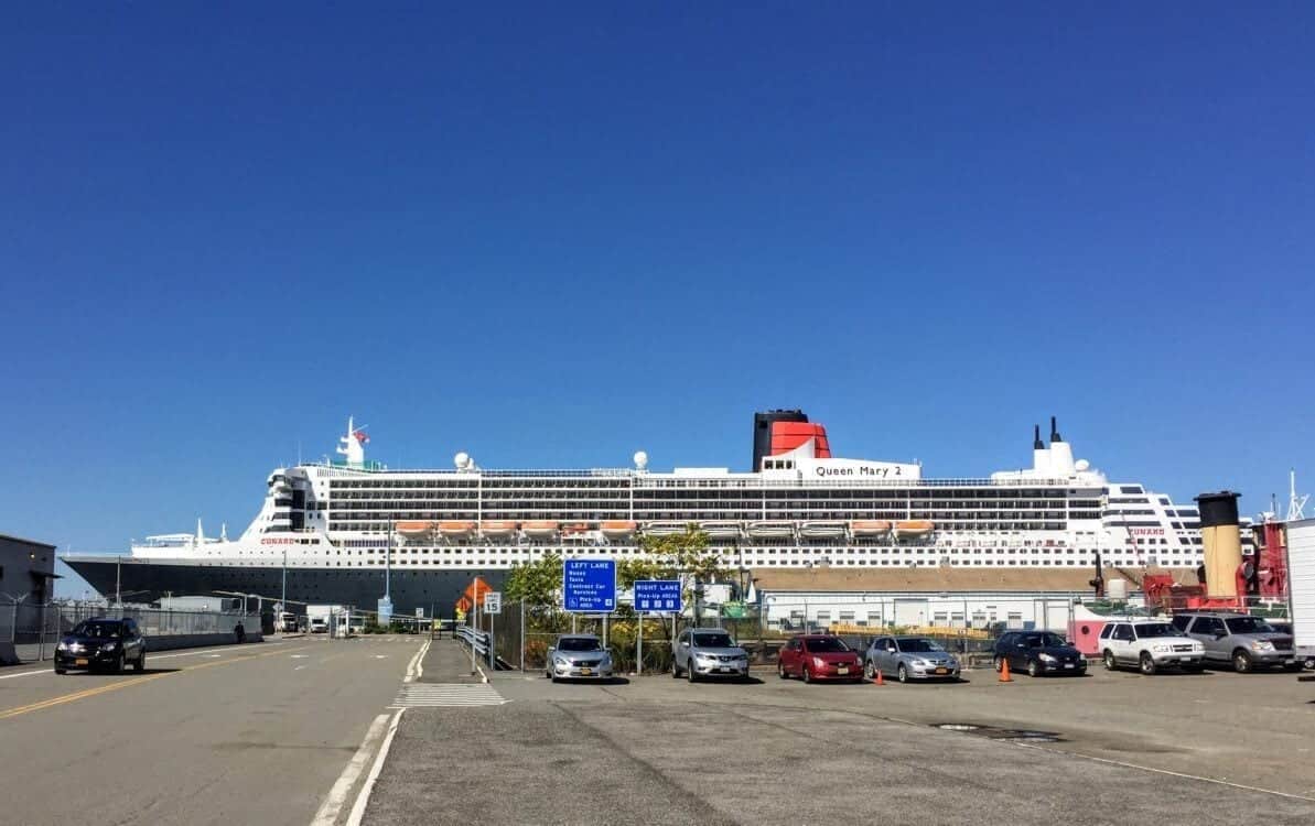 Full view of the side of Queen Mary 2 docked in Brooklyn.