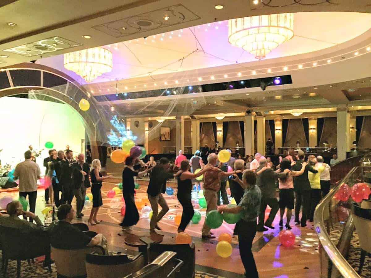 Queen Mary 2 cruise activities include conga dance line.