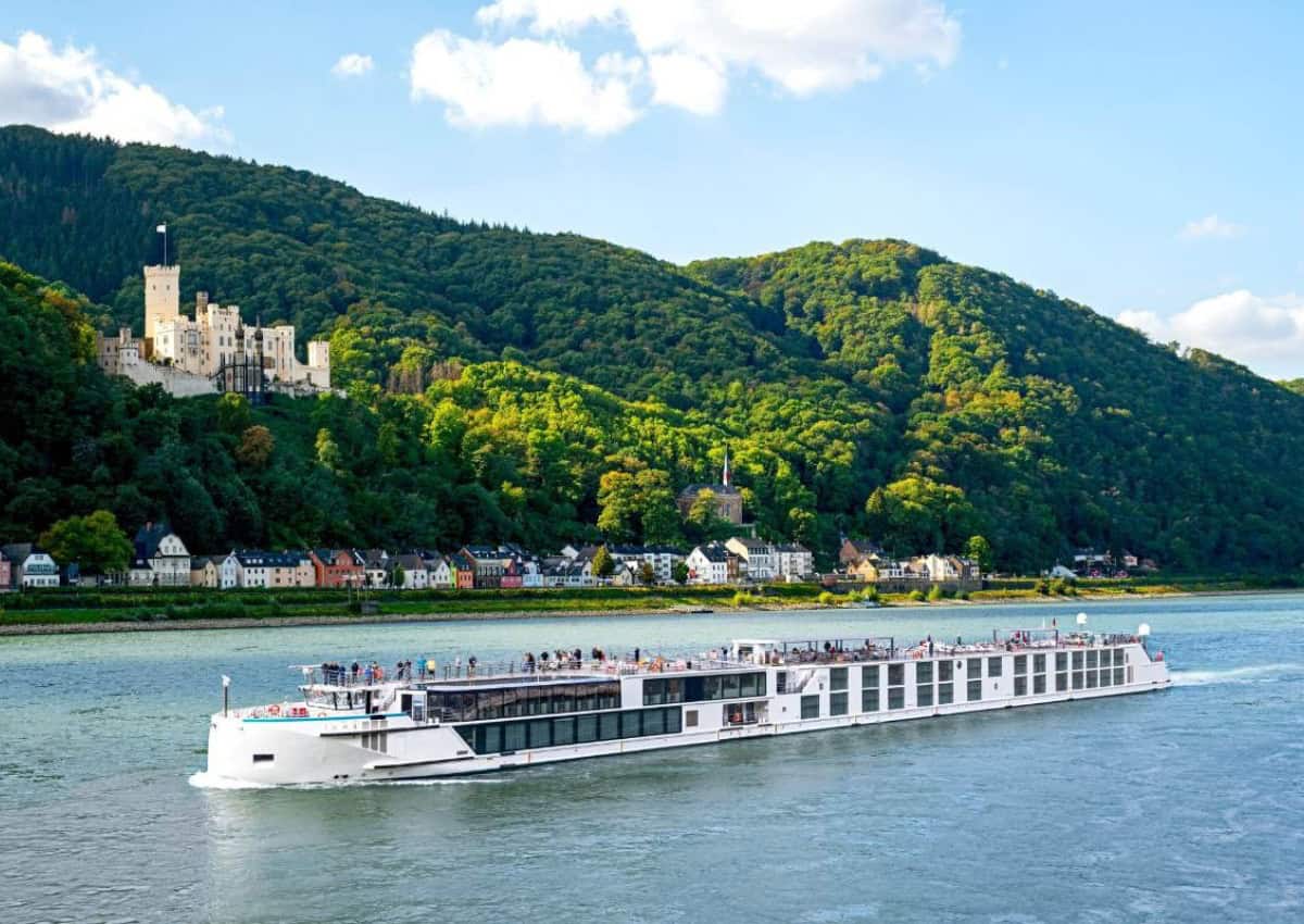 Europe River cruise boat sailing down river.