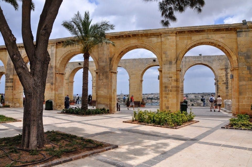 Archways at Barrakka Gardens open to the sea in Valletta, Malta.