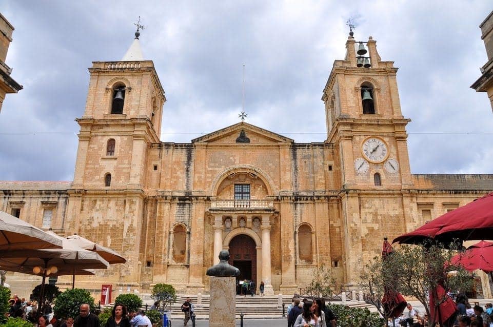 Front of St. Johns Co-Cathedral with two twin bell towers.