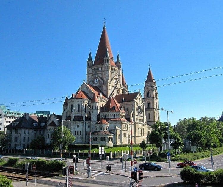 St. Francis of Assisi Church almost looks like a castle. Photo taken from the pedestrian pathway on the Reichsbrücke bridge at the Danube.